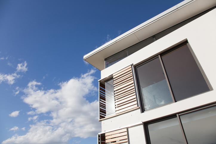 Low angle view of wood shutters on modern house